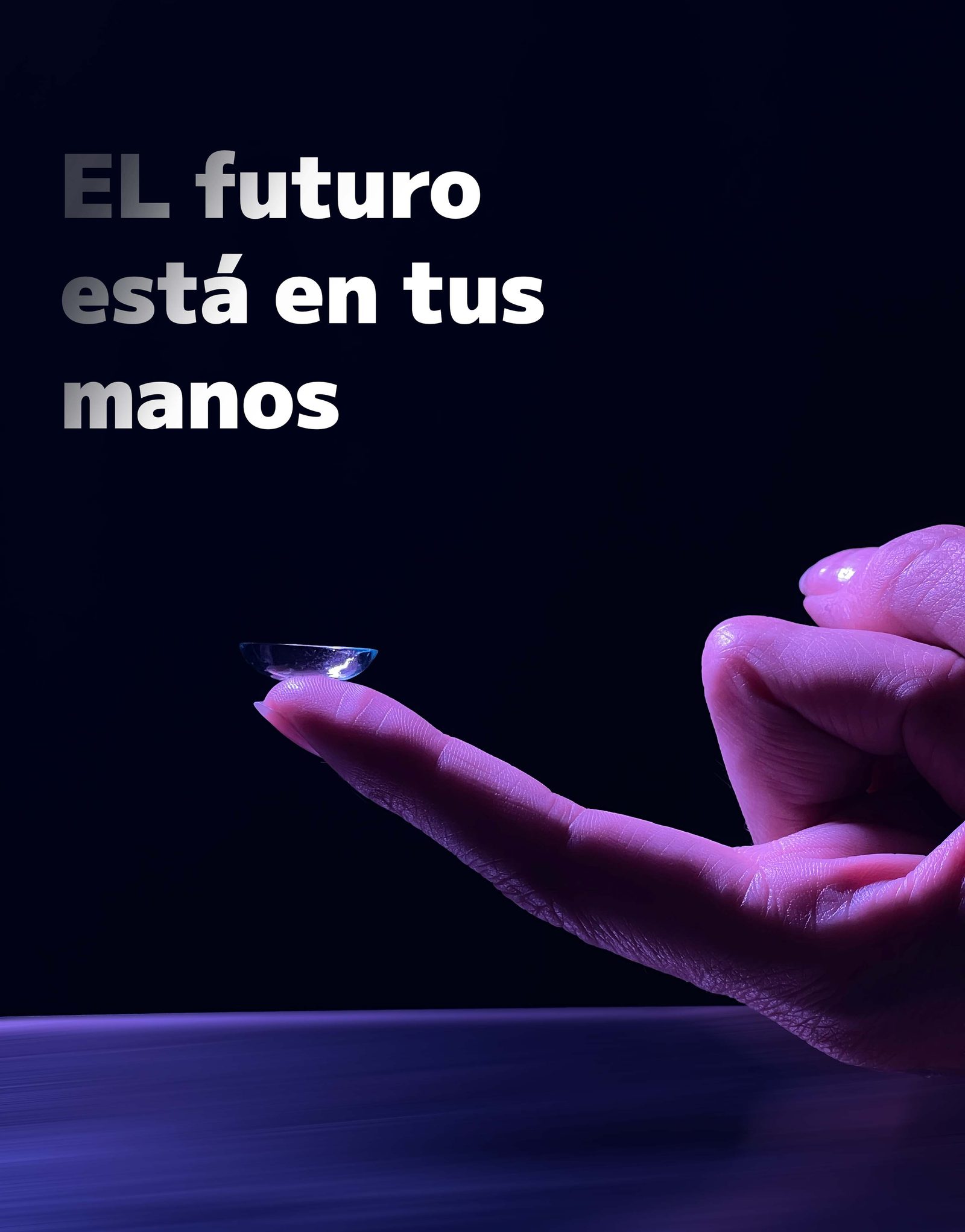 Hand holding EDEN contact lens with dramatic lighting