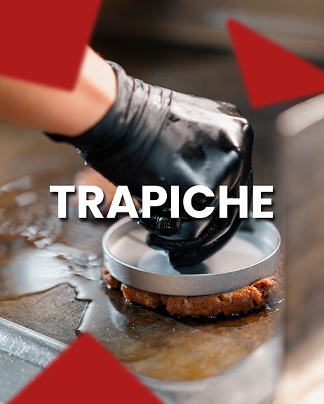 Smash burger being pressed on grill